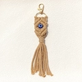 Handgefertigter Evil Eye Schlüsselanhänger mit Baumwollgeflecht und goldener Quaste - Erdgelb
