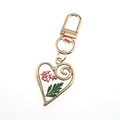 Creative heart shaped keychain with real red dried flowers in clear resin and gold frame - Green Leaves and Red Flowers