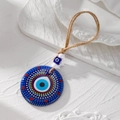 Detail of blue acrylic evil eye pendant with tribal painted dots and hemp rope - Painted Polka Dots(12#)