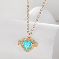 Elegant gold heart opal necklace with crystal angel wings on a white pedestal - Heart Wing (Stainless Steel Chain)