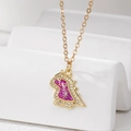 Close-up of golden dinosaur necklace with purple opal resin and sparkling crystal bezel - Purple Dinosaur