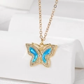 Elegant gold-plated butterfly necklace with blue opal stones and sparkling zircon accents - Blue Butterfly