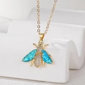 Detail of a gold bee pendant necklace with blue opal wings and sparkling zircon pavé - Bee/Moth (Stainless Steel Chain) / Blue Moth
