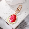 Llavero bohemio geométrico de aleación dorada con gota de mármol y detalle en esmalte - Rojo Blanco
