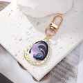 Detail of bohemian geometric keychain with purple marble enamel swirl and gold plating - Black Purple