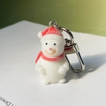 Cute flocked snowman keychain with red hat and scarf on a white card background - Snowman