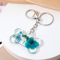 Porte-clés os de chien en acrylique avec fleurs séchées bleues et fermoir argenté - Fleurs Bleues (Fermoir Argenté)