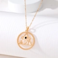 Detailed close-up of golden evil eye pendant with intricate occult triangle design - Hollow Horus Eye Style (AN200)