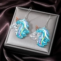Sparkling blue acrylic unicorn earrings with colorful glitter and silver metal hooks - Sky Blue Unicorn