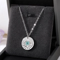 Macro shot of silver evil eye pendant with sparkling crystals in a black jewelry box - Silver Hollow Eye