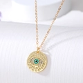 Gold evil eye coin necklace with blue enamel and sparkling crystals on a cross chain - Gold Hollow Eye