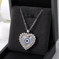 Collana a cuore in argento con pendente malocchio e strass brillanti su base velluto - Occhio a Cuore con Strass Argento