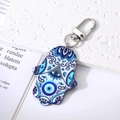 Vintage Hamsa hand keychain with evil eye patterns on blue and white acrylic - Blue and White Lotus Eye