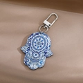 Detail of Hamsa Hand keychain with blue mandala pattern and evil eye on brown satin - 14# Blue White Eye