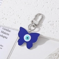 Blue butterfly evil eye keychain with enamel finish on a minimalist marble background - Silver Butterfly