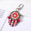 Detailreicher Hamsa-Hand-Schlüsselanhänger mit blauem Evil Eye-Muster und silbernem Verschluss - Reddish Brown Hexagram