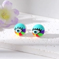 Close-up of pearl stud earrings with colorful evil eye graffiti and rainbow pattern - Multi-Color Lake Blue