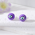 Pendientes de perlas moradas con diseño de ojo turco sobre fondo de piedra blanca fina - Ojo Morado