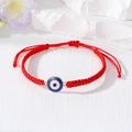 Detail of red braided Evil Eye bracelet with blue pendant and adjustable knot closure - Royal Blue And White Round Eye
