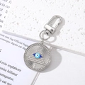 Silver Evil Eye Hamsa Hand keychain with crystal heart and pyramid charm on white background - Round Pyramid Eye Silver