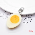 Detailed macro view of a 24.8g realistic resin half-cut egg keychain with silver lobster clasp - Half Egg