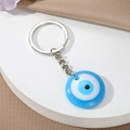 Türkischer Evil Eye Schlüsselanhänger mit rundem Nazar-Anhänger aus Harz und Silberring - Himmelblau