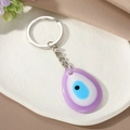 Paarse Evil Eye sleutelhanger in druppelvorm met zilveren ring op decoratie - Paarse Waterdruppel