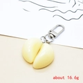 Detailed realistic garlic clove keychain made of resin with silver metal carabiner, 16.6g - Two Garlic Cloves