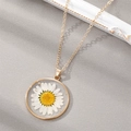Delicate gold-tone necklace featuring a real daisy flower preserved in a round resin pendant - April White Daisy (Necklace)