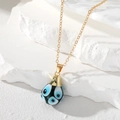 Vintage gold stainless steel necklace with waterdrop evil eye glass charm on white rock - Black