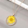 Golden necklace with a round pendant featuring a yellow daisy dried flower inside - October Yellow Chrysanthemum (Necklace)
