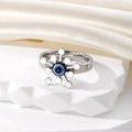 Bague rétro œil grec en métal argenté avec fleur évidée et perle bleue design solaire - Étoile Argentée