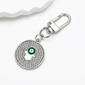 Macro detail of silver Hamsa Hand keychain with crystal pavé and blue evil eye charm - Silver Green Eye Hamsa Hand