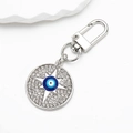 Detailed view of silver evil eye keychain with sparkling rhinestones and lobster clasp - Silver Royal Blue Eye Star