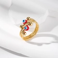 Macro di anello a spirale dorato con dettaglio occhio smaltato e trama diamantata - Occhio Rosso