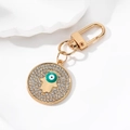 Golden Hamsa Hand keychain with crystal Evil Eye pendant and turquoise accents - Gold Green Eye Hamsa Hand