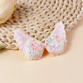 Macro view of glittering pink butterfly wing patch for children's DIY hair accessories - Soft Pink