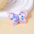 Detail eines rosa Schmetterlingsaufnähers mit blau schimmernden Pailletten für DIY-Haarschmuck - Irisierendes Blau Rosa