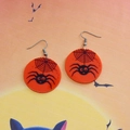 Halloween acrylic round drop earrings featuring black spider web pattern on orange disc - Round Spider (Cross Hook)