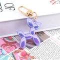 Balloon dog keychain in iridescent purple finish with golden metal lobster clasp - Metallic Purple