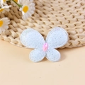 Light blue butterfly hair accessory with silver glitter and a pink diamond center - Blue