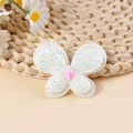 Beige butterfly accessory with glitter finish and a pink gemstone for DIY hair clips - Off White