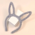 Close-up of soft gray plush bunny ear headband showing fluffy texture and flexible ears - Gray