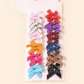 Detailed set of 12 colorful grosgrain ribbon bow clips on white display card - Solid And Polka Dot Mix / Combination 1