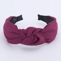 Detail view of purple wide headband featuring premium twill fabric and twisted knot design - Dark Purple