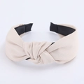 Minimalist beige twisted wide headband with textured fabric and soft black inner lining - Off White