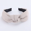 Classic light brown wide fabric headband featuring a stylish twist knot and twill texture - Beige