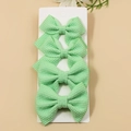 Set of 4 mint green waffle texture hair bows for girls on a white card - Grass Green