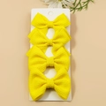 Set of four bright yellow waffle texture ribbon hair bows on display card - Yellow