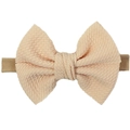 Soft apricot nylon baby headband featuring a textured waffle knit ribbon bow for infants - Apricot